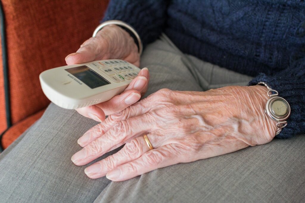 Elderly with Phone Staying Connected