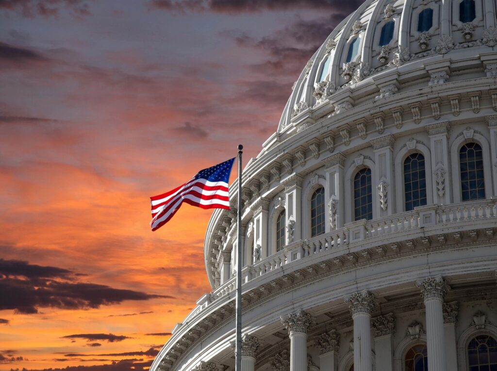 Picture of American flag and capitol building; TRUST bill introduced to help Social Security Funds