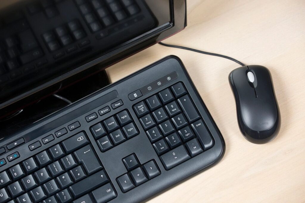 Birds eye view of computer keyboard and mouse; accessing Social Security online portal