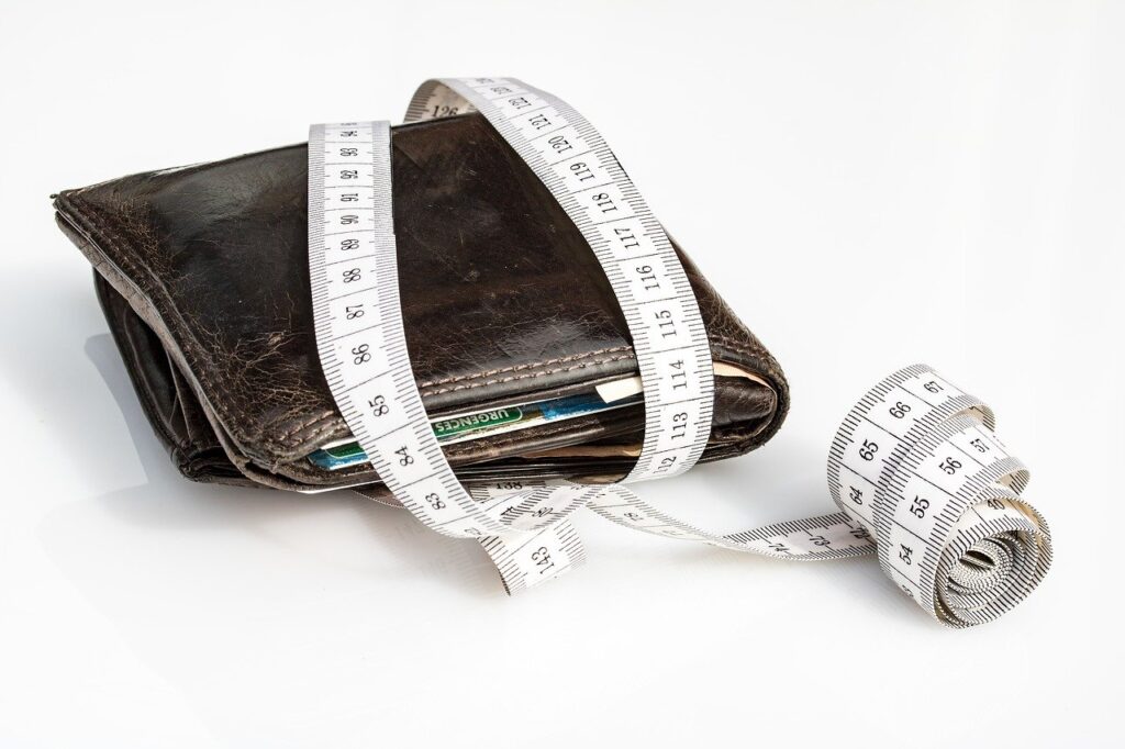 Tape Measure Around Wallet; Taxes lower benefit payments