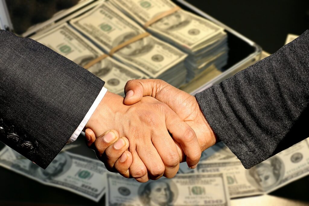 Shaking Hands with money in background; Social Security Trust Funds