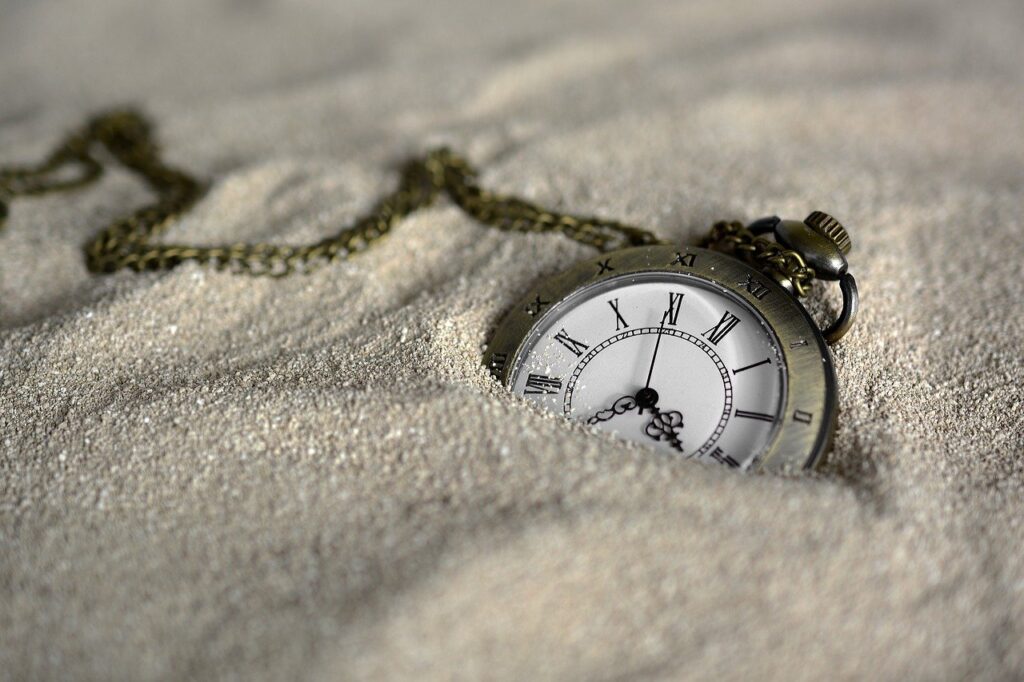 pocket watch in the sand; we anxiously wait to see what the future of Social Security looks like