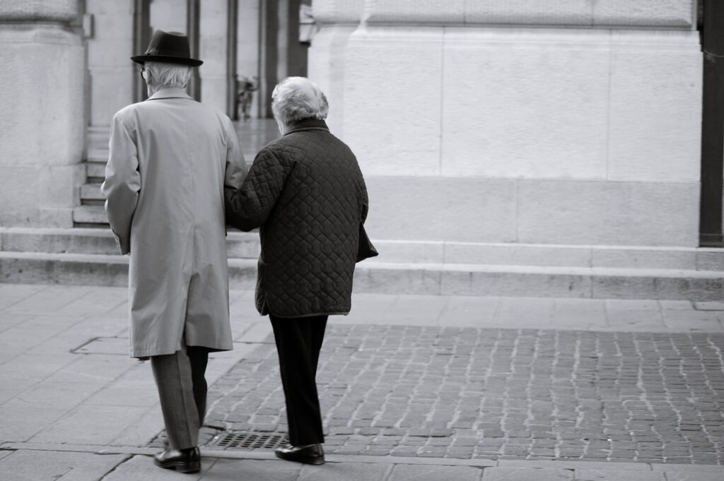 elderly couple walking; welfare program