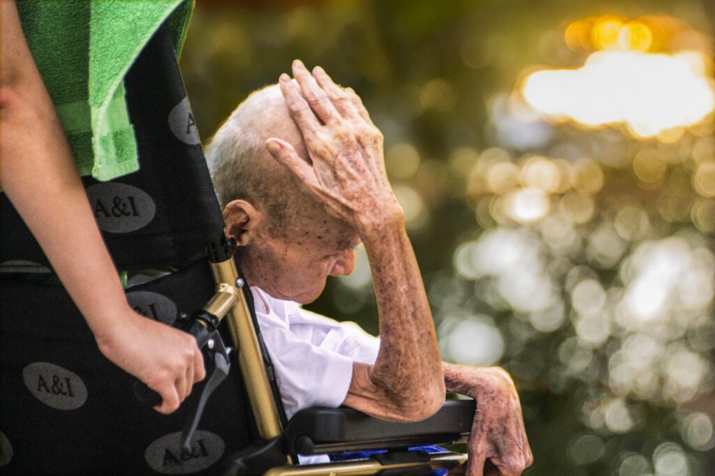 Elderly man in wheelchair; COLA increases don't account for much needed healthcare