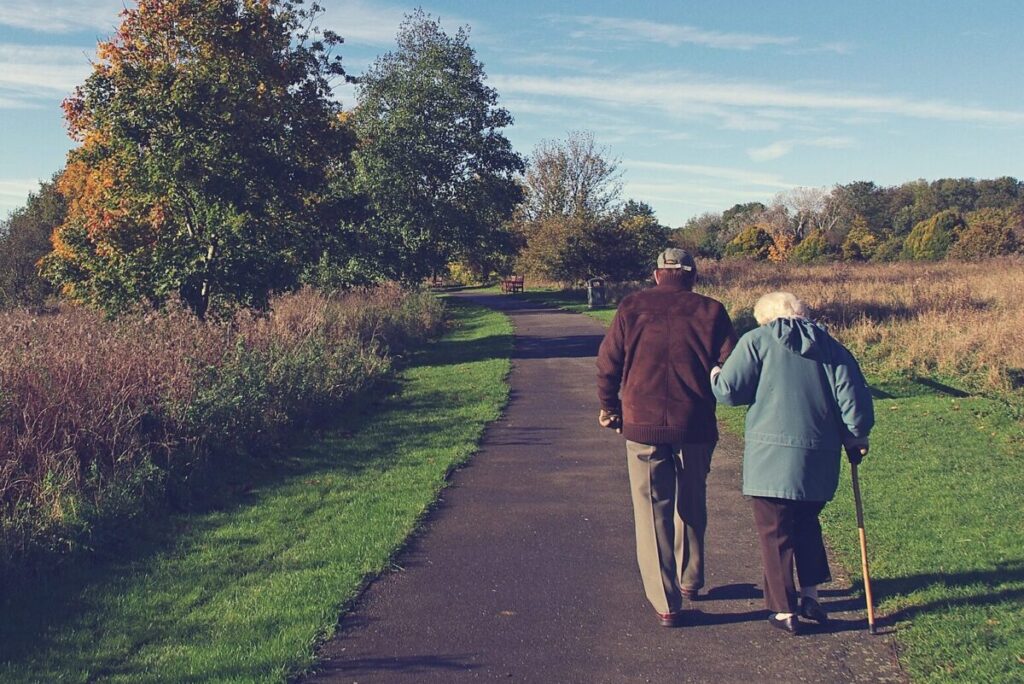 elderly couple walking